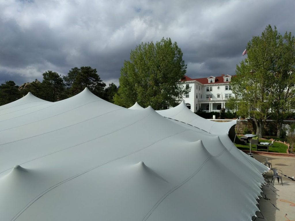 Stanley-hotel-wedding-canopy View of Stanley Hotel over wedding stretch tent