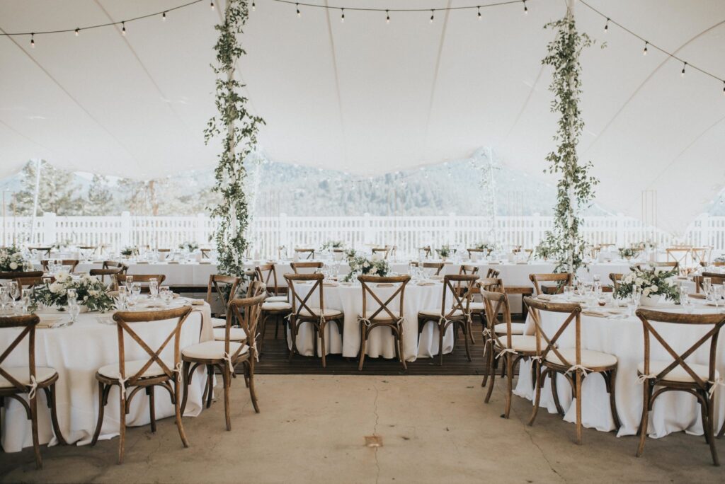Estes Park Wedding Tent Wedding Tent in Estes Park with Flowers and Market Lights