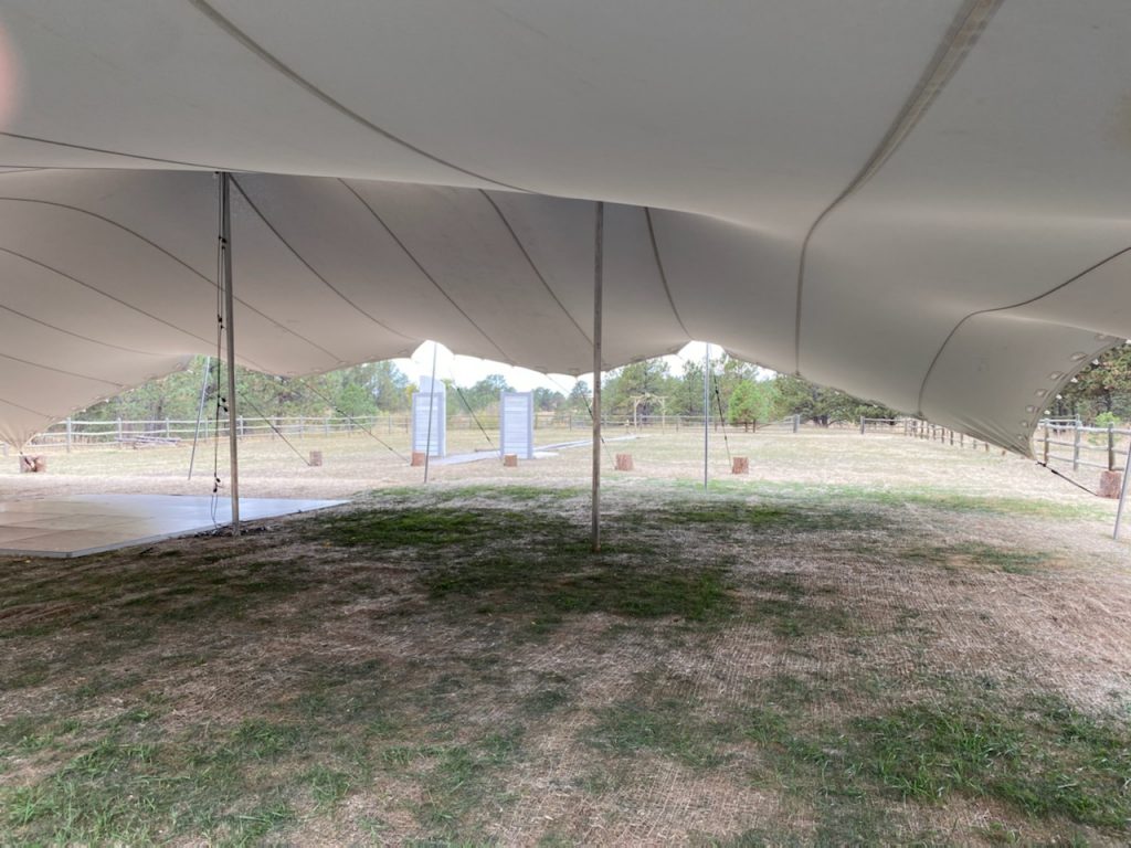 Preparing-the-tented-pasture-for-wedding Black Forest Stretch Tent Rental