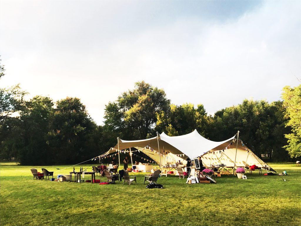 Wedding-tent-with-bunting-at-Printers-Home Stretch Tent Rental