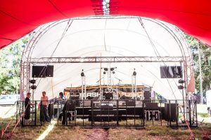 Tented stage covering with box truss for light and sound mounts
