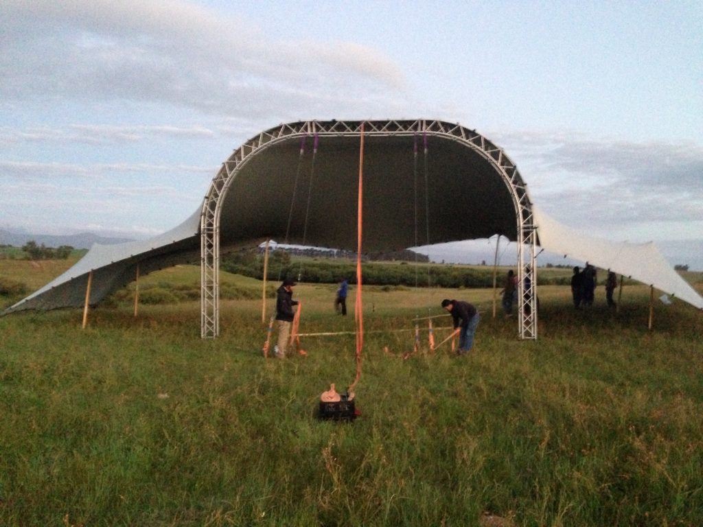 Stage tent covering Arch box truss with tent